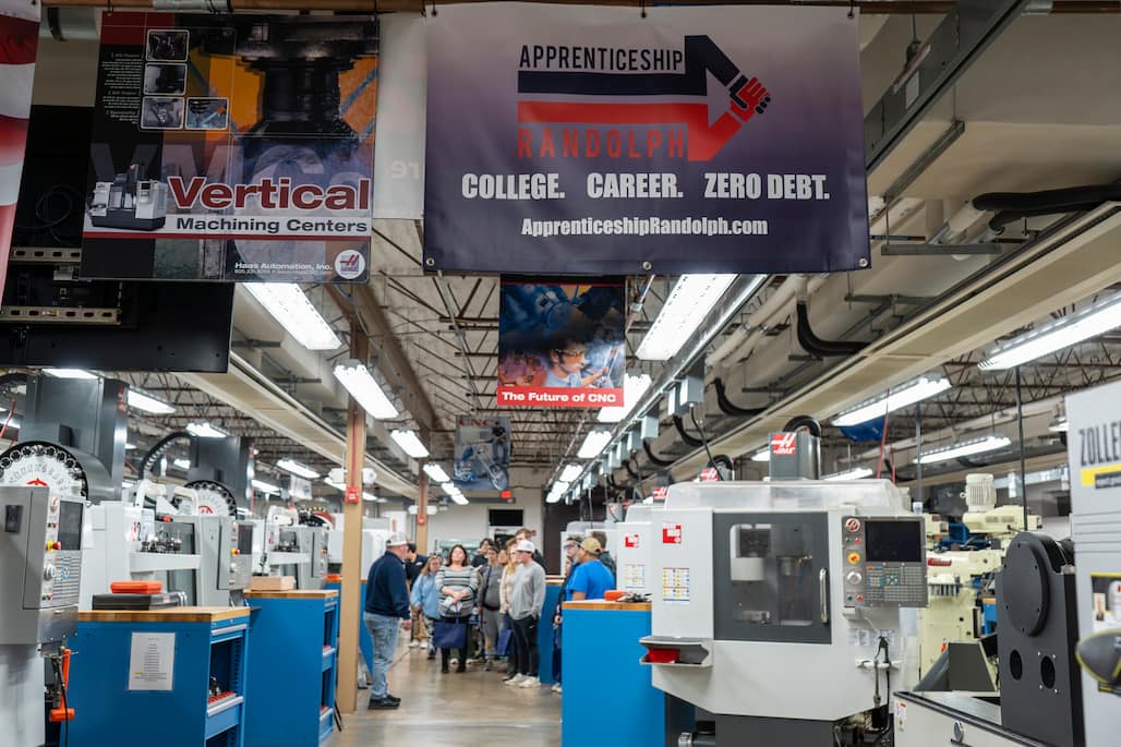 Photo of a group of people touring Randolph Community College's Computer-Integrated Machining lab.