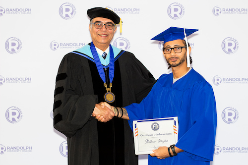 Photo of a graduate with RCC President/CEO Dr. Shah Ardalan.