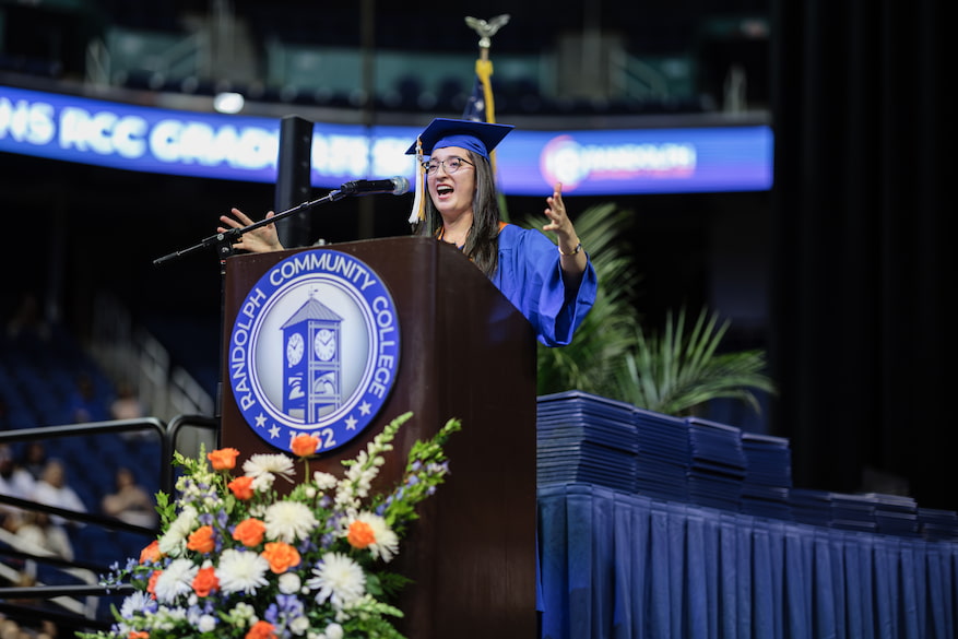 Photo of a graduate giving a speech.